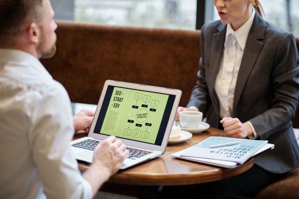 Business meeting discussing SEO strategy